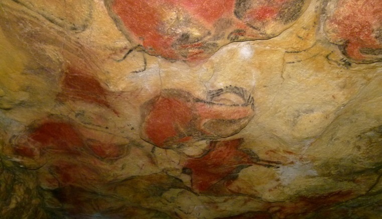 Vibrant illustrations visible deep within the Altamira caves